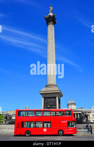 Iconic Red London Arriva double decker public transport bus no adverts passing Nelsons column blue sky summer day Trafalgar Square London England UK Stock Photo