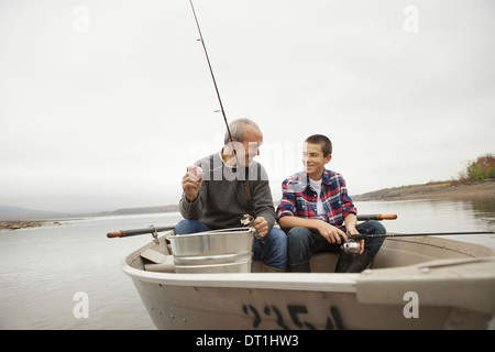 A day out at Ashokan lake A man and a boy sitting fishing from the boat
