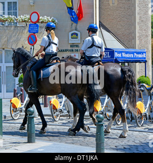 Mounted police officers patrolling on horseback in Brussels Belgium Stock Photo