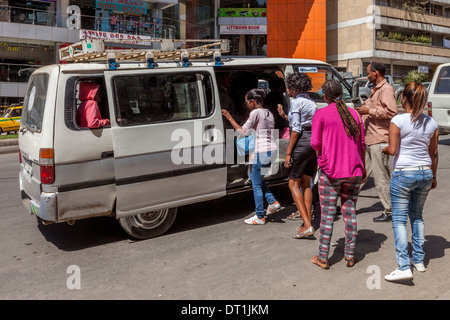 Local People Getting Into A Shared Taxi/Minibus, Churchill Avenue, Addis Ababa, Ethiopia Stock Photo