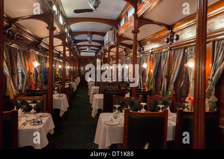 Galleried wood panelled Edwardian vintage dining coach on the Rovos Rail luxury train, Western Cape, South Africa, Africa Stock Photo