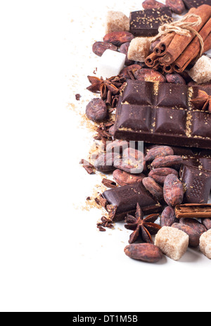 Dark chocolate with cocoa beans, cinnamon and anise over white Stock Photo