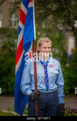 Girl Scout holding flag during June 17th, Iceland´s Independence Day, Reykjavik, Iceland Stock Photo