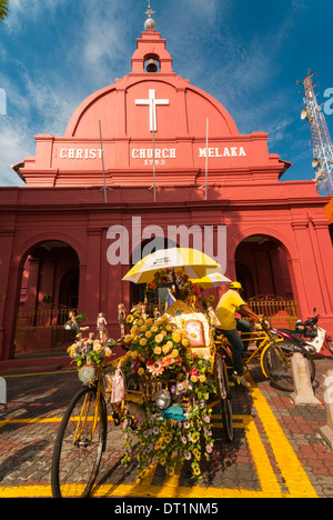 Rickshaw and Christ Church, Town Square, Melaka (Malacca), UNESCO World Heritage Site, Melaka State, Malaysia, Southeast Asia Stock Photo