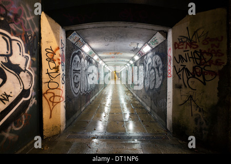 Inner city underpass covered in colorful graffiti Stock Photo