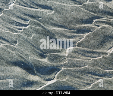 Close up of erosional sand patterns on beach and intertidal zone Ocean Park Stock Photo