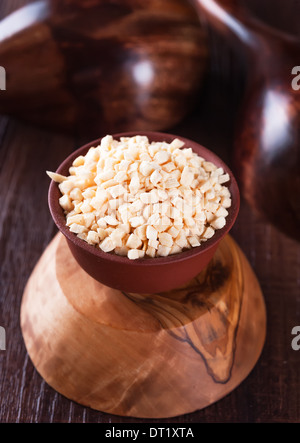 Dried garlic granules in the bowl, closeup Stock Photo