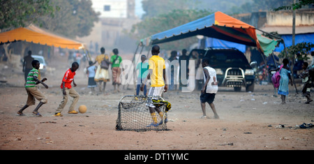 Boys playing football (soccer) in Bobo Dioulasso, Burkina Faso Stock Photo