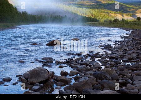 Morning fog on river Shishged in northern Mongolia Stock Photo