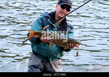 Fishing on river Shishged in the Mongolia - the lenok fish in hand Stock Photo