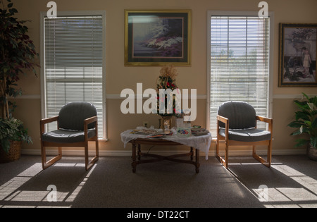 Sunlight streaming through windows in Doctor's office waiting room. Stock Photo