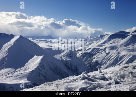Speed flying in sunny winter mountains. Caucasus Mountains. Georgia, ski resort Gudauri. Stock Photo