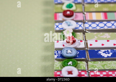 Decorative peg pattern on a green spotty background. Stock Photo