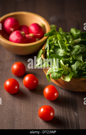 Cherry tomatoes, radishes and lettuce Stock Photo