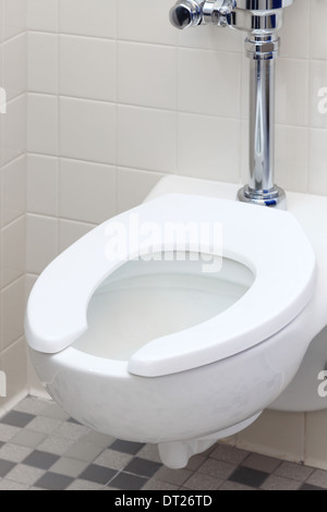 a toilet in a modern public mens room        