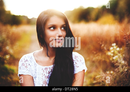 Portrait of young woman with long black hair Stock Photo