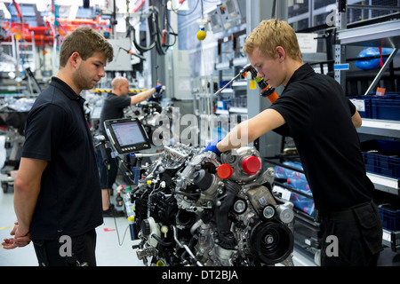 Mercedes-AMG engine production factory Germany - trainee engineer supervised hand-building M157 5.5L V8 biturbo engine, Germany Stock Photo