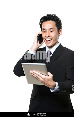 Chinese businessman with a tablet computer. Isolated on a white background. Stock Photo