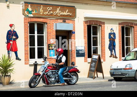French man on Harley Davidson Motorbike at Bar La Madelon on the Champagne Tourist Route at Mancy, Champagne-Ardenne, France Stock Photo