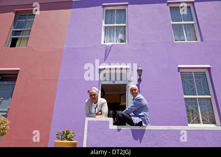 local woman and their typical coloured homes in the quarter Cape Malay Bo-Kaap, Cape Town, Western Cape, South Africa Stock Photo