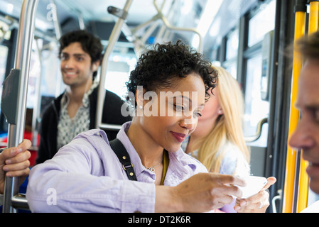 City bus on the side of the road stop, side view on sky background ...