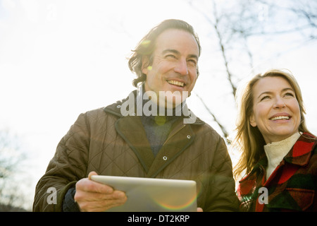 An Organic Farm in Winter in Cold Spring New York State A man holding a digital tablet in his hands Stock Photo