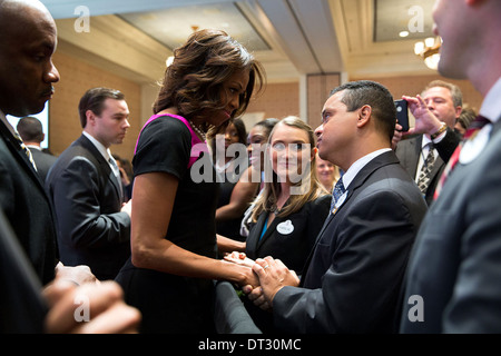 US First Lady Michelle Obama greets attendees after she delivers the keynote address at Disney's Veterans Institute Workshop at the Walt Disney World Resort November 14, 2013 in Orlando, FL. Stock Photo