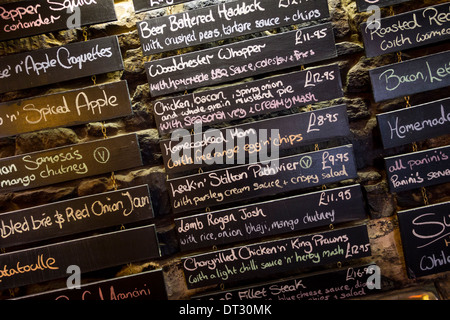 Hand written menu on blackboards in a pub, Gloucestershire, UK Stock Photo