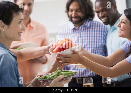A picnic party of family adults and children Stock Photo