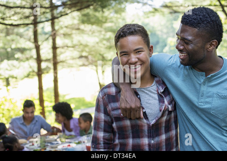 A man and a young boy looking at the camera Stock Photo