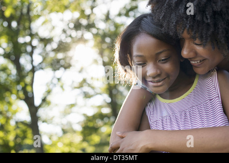African american child with curly hair holding paper airplane annoyed ... Boy And Girl Hugging Drawing
