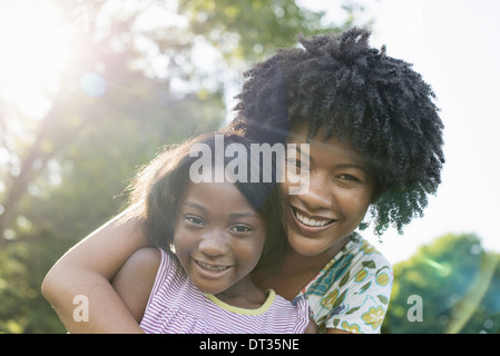A young woman and a child hugging