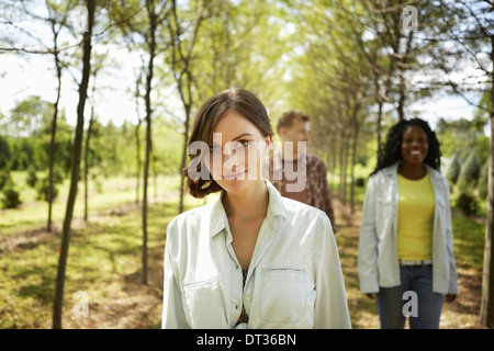 Friends on a woodland path in summer Stock Photo