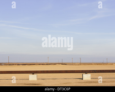 Elevated oil pipeline in the Midway-Sunset oil fields, the largest shale oil field in California. Stock Photo