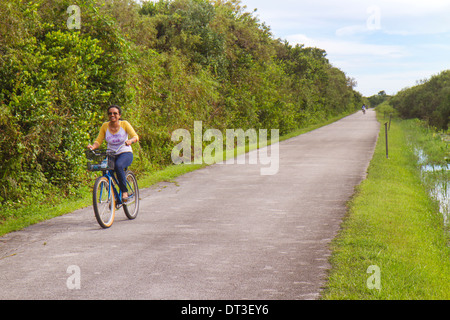 Miami Florida,Everglades National Park,Shark Valley,Tram Tour Trail,bike,bicycle,bicycling,riding,biking,rider,riding,nature,Asian Asians ethnic immig Stock Photo