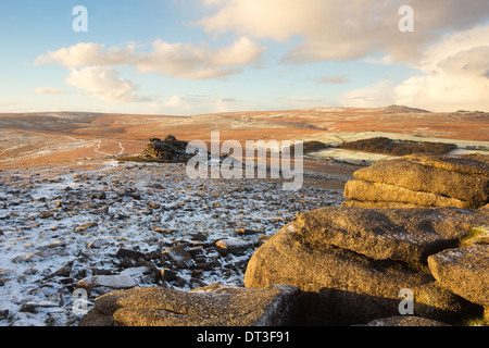 A light dusting of snow on Belstone tor with views towards Higher tor  Dartmoor national park Devon Uk Stock Photo