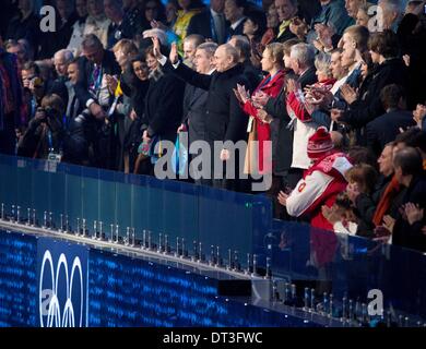 Sochi, Russia. 7th Feb, 2014. Russian President Vladimir Putin, center right and, International Olympic Committee President Thomas Bach, center left, waves to crowd during the Opening ceremony in Fisht Olympic Stadium at the 2014 Winter Olympics in Sochi. Credit:  Paul Kitagaki Jr./ZUMAPRESS.com/Alamy Live News Stock Photo