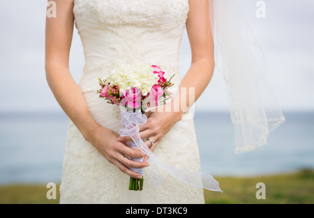 Beautiful bride with bouquet of flowers Stock Photo