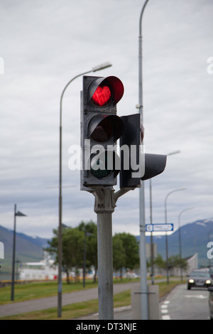 Red traffic light in the shape of a red heart, Akureyri, Iceland Stock Photo