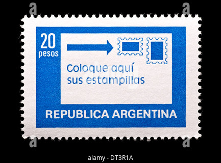 Postage stamp from Argentina depicting a letter and stamps, issued to remind mailers of the correct positioning of stamps. Stock Photo