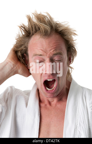 Man waking up yawning on white background Stock Photo