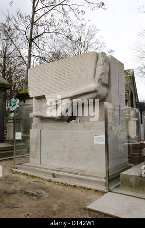 Oscar Wilde grave at the Pere Lachaise, Cemetery in Paris, protected  with glass barrier against kisses, France. Stock Photo