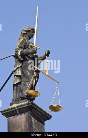 Statue of Lady Justice with sword and balance scales, not blindfolded Stock Photo