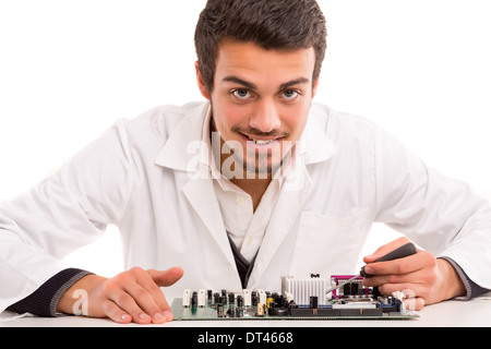 A computer engineer or technician, working on a computer motherboard Stock Photo