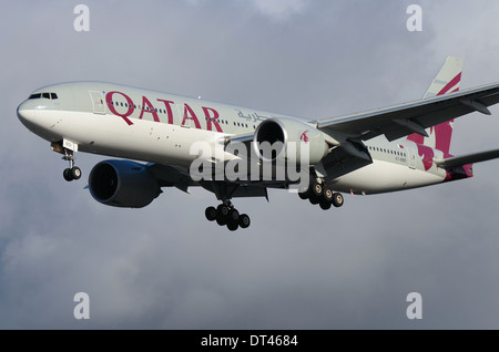 Qatar Airways Company Q.C.S.C., operating as Qatar Airways, is the state-owned flag carrier of Qatar. Qatar Boeing 777 jet plane landing at Heathrow Stock Photo