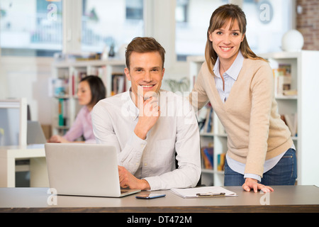 Businesspeople happy desk computer casual Stock Photo