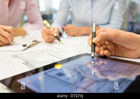 Business team desk architect man woman digital tablet blueprint construction Stock Photo