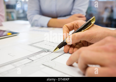 Business team desk architect man woman digital tablet blueprint construction Stock Photo