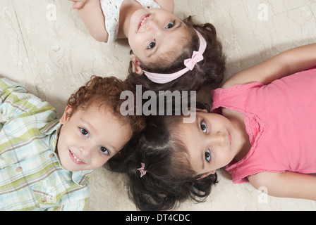 Triplets on the floor Stock Photo