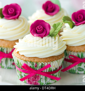 Cupcakes decorated with pink sugar roses Stock Photo